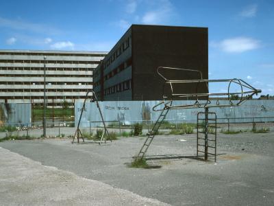 View of 8-storey block in Netherley with park and low-rise block in foreground